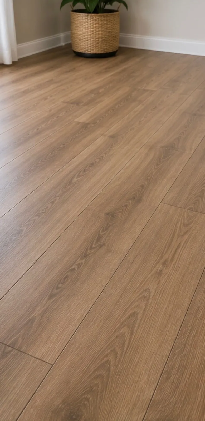 Close-up of a newly installed wood-look plank floor